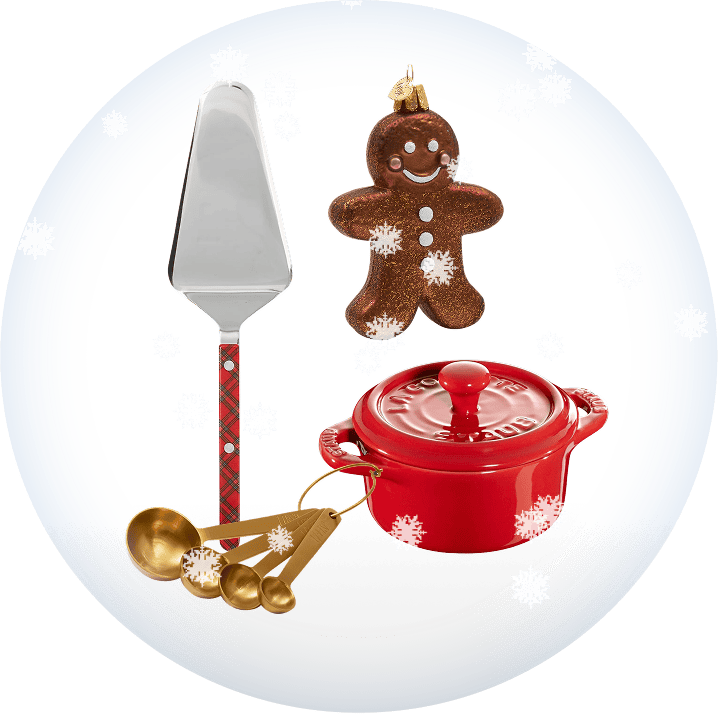 Set of Christmas-themed kitchen items including a red pot, gingerbread man ornament, tart server, and measuring spoons on a transparent background with snow.
