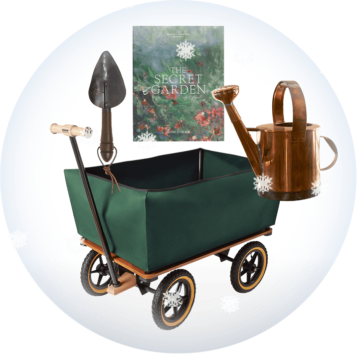 Green garden cart with gardening tools and a book titled 'The Secret Garden' on a transparent background with snow.