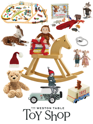  Collection of toys including a wooden rocking horse, Steiff teddy bear, Maileg mice, and other items in the Weston Table Toy Shop. 