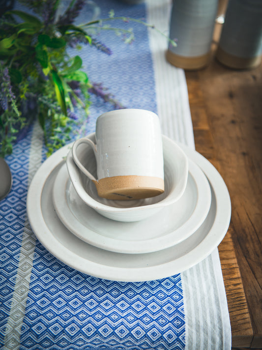 https://westontable.com/cdn/shop/products/Farmhouse-Pottery-White-Silo-Place-Setting-4-Piece-Weston-Table_3809bfd3-a2a5-4dd5-97a4-3a6981d0f783.jpg?v=1593691080&width=533