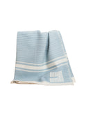 Swans Island Modern Grace Baby Blanket Sky Blue with White Weston Table